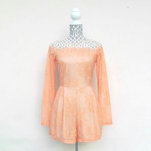 Pretty peach romper. This romper has pockets! Lovely, never been worn.